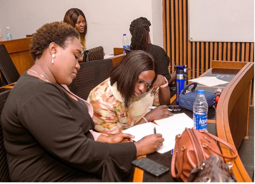 Two colleagues working through a problem together during a session