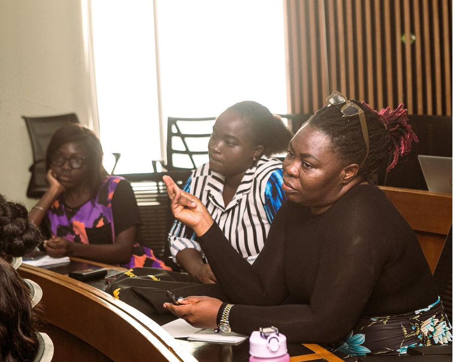 A learner talking through her work at the laptop